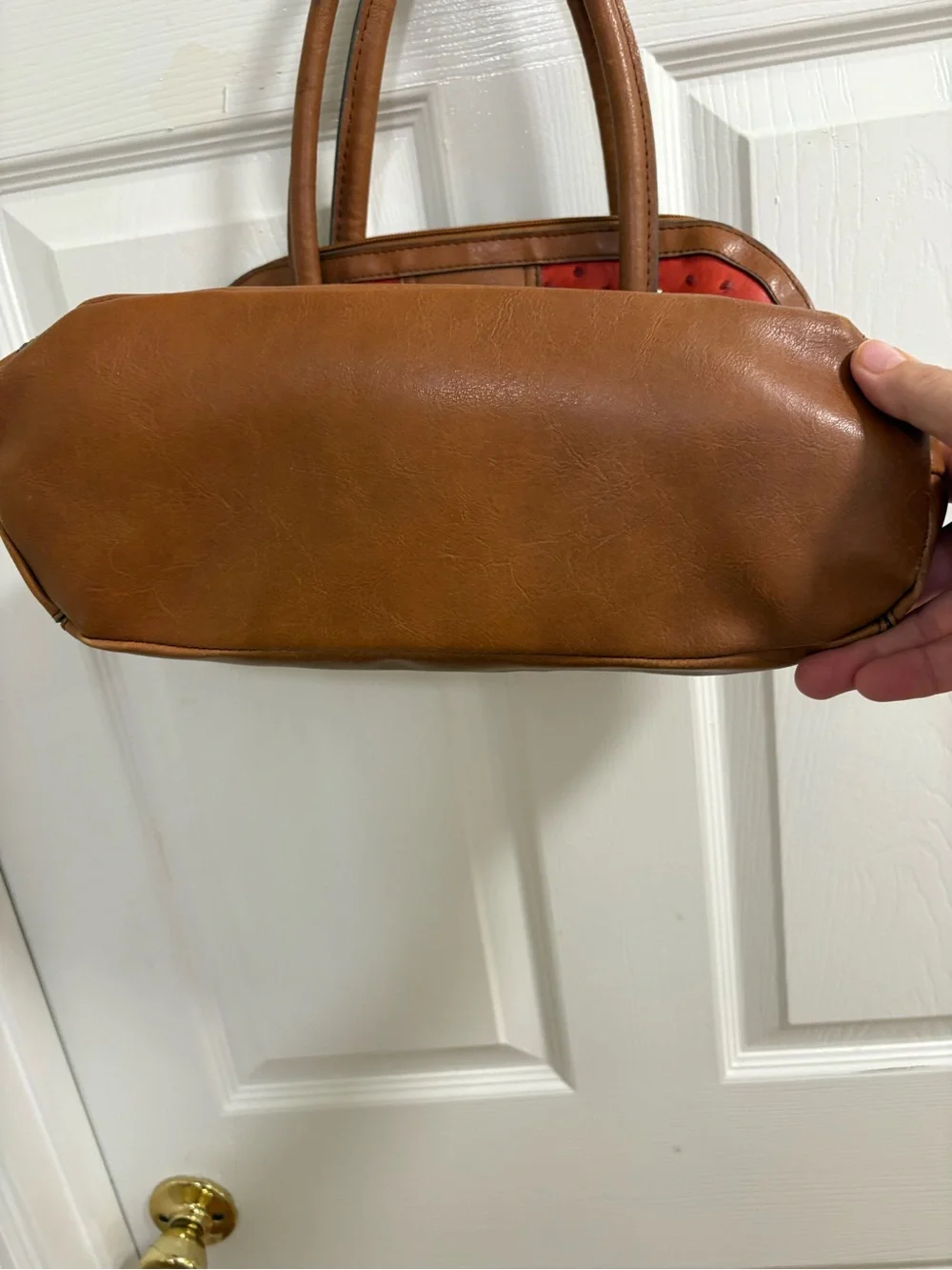 London Fog satchel features a distinctive red ostrich print and lock& key